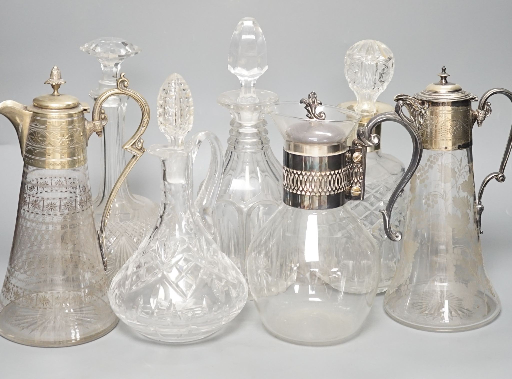 A Hukin and Heath claret jug and other decanters etc.